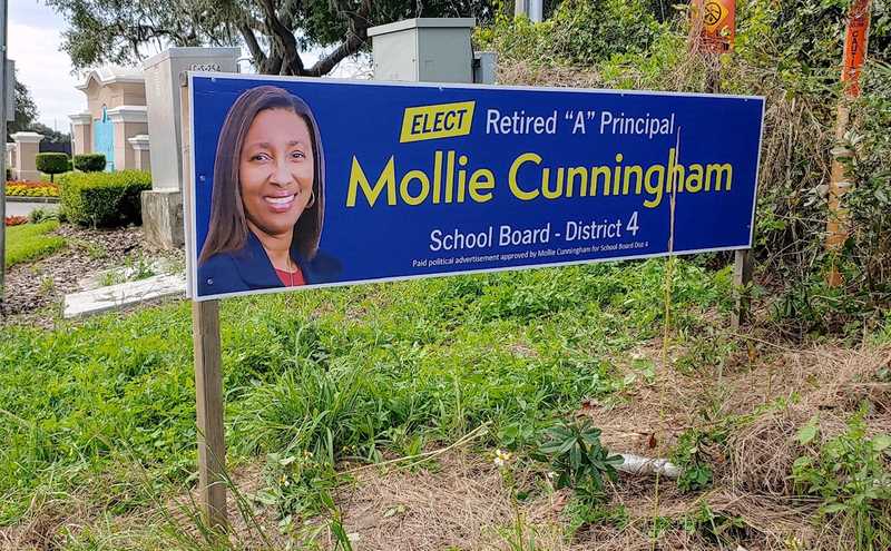 Mollie Cunningham for Lake County School Board Dist 4 campaign sign, which reads 'Elect retired A principal Mollie Cunningham School Board District 4'